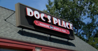 Exterior sign of Doc's Place Karaoke Bar, suggested as a leisure activity in Chicopee.
